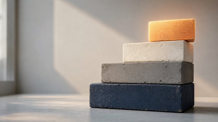 A four-step stack of blocks with a glowing top block balanced unevenly, showing advanced technology resting on an incomplete foundation.